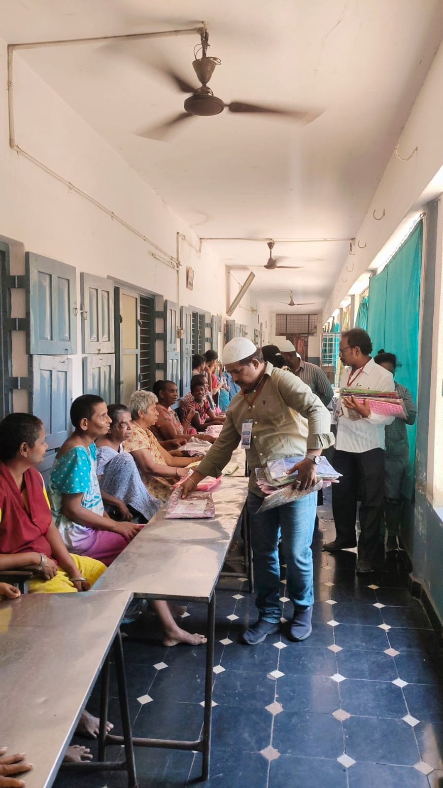 AIPIF volunteers spending time with elderly residents at an old age home