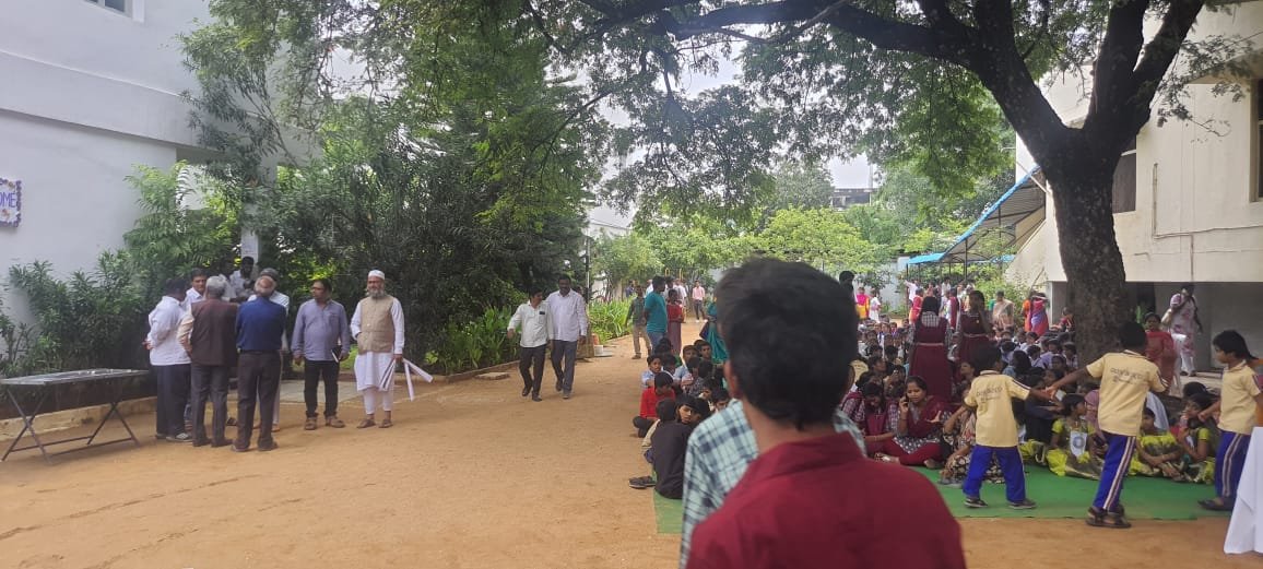 AIPIF volunteers spending time with children at an orphanage
